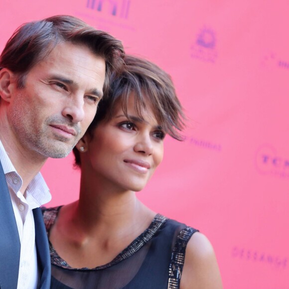 Olivier Martinez et Halle Berry enceinte lors du Champs-Elysées Film Festival 2013 à Paris le 13 juin 2013.