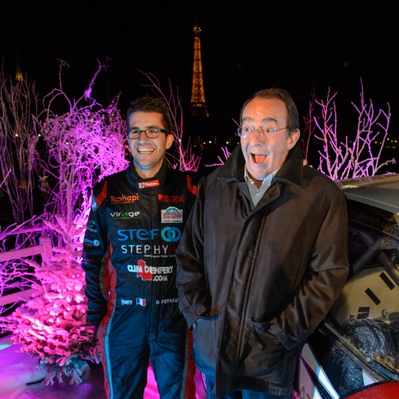 Jean-Pierre Pernaut et son fils Olivier Pernaut lors de la présentation de leur nouvelle voiture du prochain Trophée Andros à Paris le 26 novembre 2015, sur un bateau-mouche © Lionel Urman