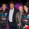 Olivier Pernaut, Jean-Pierre Pernaut, Jacques Laffite et Margot Laffite lors de la présentation de leur voiture pour le Trophée Andros à bord des Bateaux-Mouches à Paris, le 26 novembre 2015