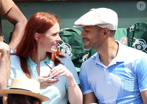 Audrey Fleurot et son nouveau compagnon Djibril Glissant assistent à la finale dame lors des Internationaux de France de tennis de Roland Garros à Paris le 7 juin 2014.