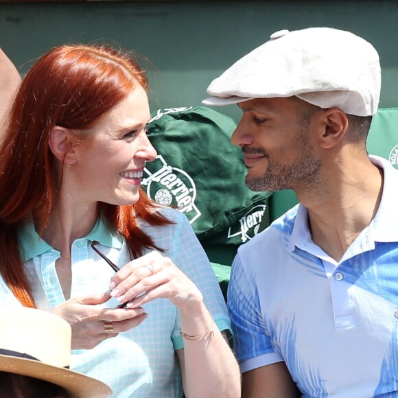 Audrey Fleurot et son nouveau compagnon Djibril Glissant assistent à la finale dame lors des Internationaux de France de tennis de Roland Garros à Paris le 7 juin 2014.