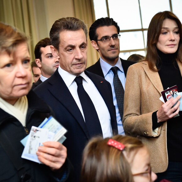 Nicolas Sarkozy et sa femme Carla Bruni-Sarkozy ont voté au lycée Jean de la Fontaine dans le 16ème à Paris pour le 2e tour des élections régionales, le 13 décembre 2015. © Pool / Bestimage
