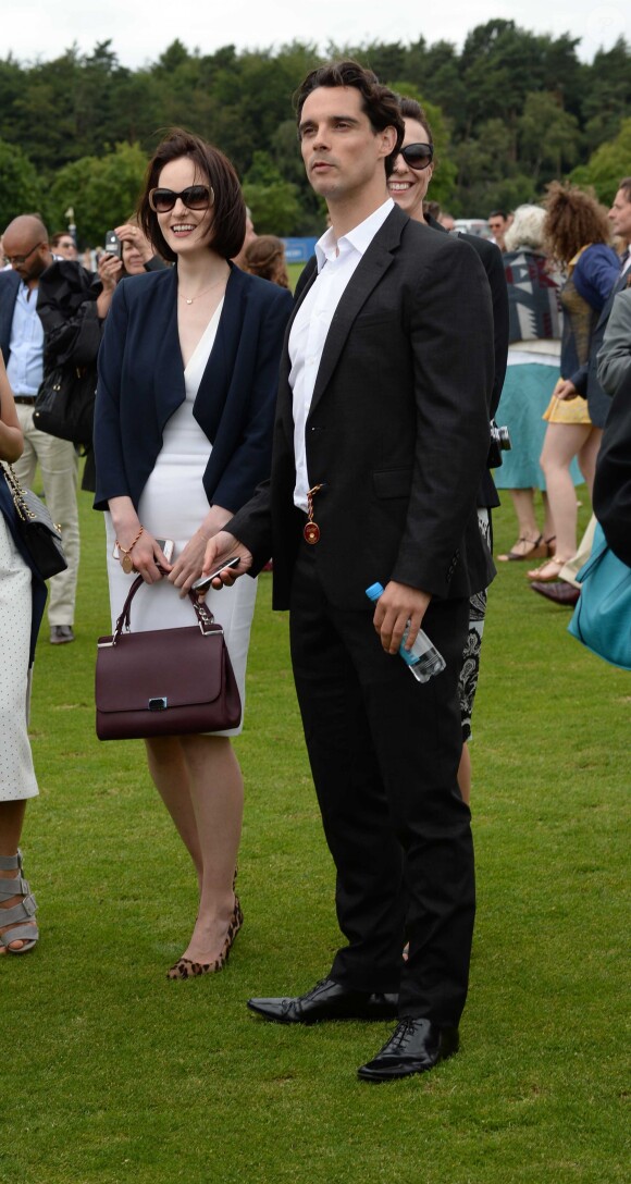 Michelle Dockery et son compagnon John Dineen lors de la finale de la "Queens Cup Polo" au Park Polo Club à Windsor, le 15 juin 2014.