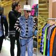 Exclusif - Rita Ora surprise dans le magasin Supreme à Los Angeles, habillée d'une veste en denim et d'un jean, d'un top rayé Enfants Riches et Déprimés et de bottines bronze. Le 19 janvier 2016.