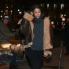 Rihanna arrive au restaurant Caviar Kaspia à Paris, habillée d'un manteau (collection automne-hiver 2015) et d'un pull à col roulé Vetements, d'un legging et de bottes Chanel. Le 18 janvier 2016.
