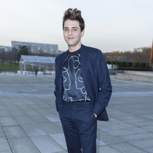 Xavier Dolan - Défilé Louis Vuitton (collection homme automne-hiver 2016-2017) à la serre du parc André-Citroën. Paris, le 21 janvier 2016.