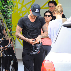 David Beckham quitte le Soul Cycle après sa séance de sport à Brentwood, le 2 août 2014. La rumeur dit son fils aîné Brooklyn Beckham sortirait avec la jeune actrice Chloë Grace Moretz.