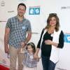 Tiffani Thiessen, enceinte, avec son mari Brady Smith et leur fille Harper à la 6ème soirée annuelle de " Milk+Bookies " à Los Angeles, le 19 avril 2015