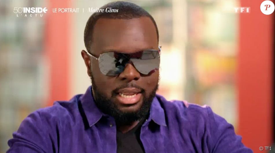 Le rappeur Maître Gims explique pourquoi il porte toujours ses lunettes de soleil. Emission &quot;50 min inside&quot; sur TF1. Le 26 mars 2016.