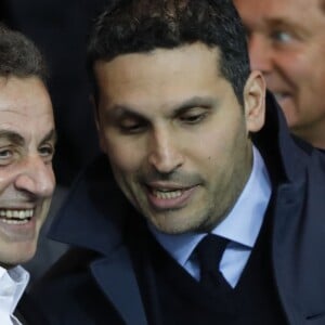 Nicolas Sarkozy et Khaldoon Al Mubarak pendant le match de Ligue des Champions PSG - Manchester City au Parc des Princes à Paris le 6 avril 2016.