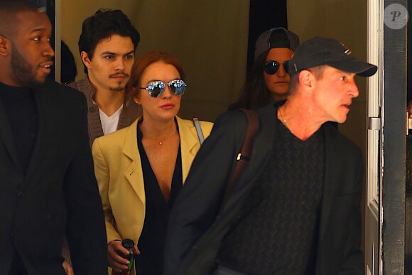 Lindsay Lohan avec son amoureux Egor Tarabasov et son père Michael Lohan dans les rues de New York, le 13 avril 2016