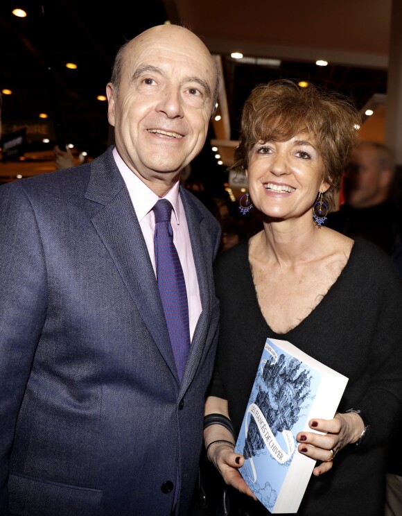 Alain Juppé et sa femme Isabelle au 33e Salon du Livre au parc des expositions de la porte de Versailles à Paris