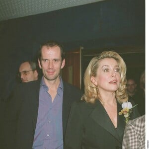 Christian Vadim et Catherine Deneuve à l'avant-première du film "8 Femmes" à Paris le 30 janvier 2002