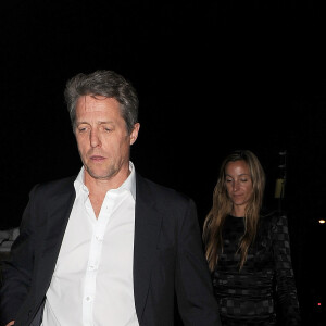 Hugh Grant et sa compagne Anna Elisabet Eberstein lors d'une soirée organisée chez Jimmy Carr à Londres, le 6 juin 2016.