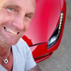 Pascal (Koh-Lanta 2016) s'amuse avec une Ferrari. Juin 2016.