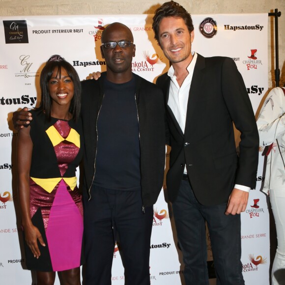 Lilian Thuram entre Hapsatou Sy et son compagnon Vincent Cerutti - Inauguration du showroom d'Hapsatou Sy au Viaduc des Arts à Paris, le 14 janvier 2016. © CVS/Bestimage