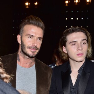 David Beckham et son fils Brooklyn - Célébrités lors du défilé de Victoria Beckham à l'occasion de la fashion week de New York le 11 septembre 2016. © CPA / Bestimage