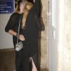 Exclusif - Lindsay Lohan sort du restaurant Rakkan avec son propriétaire et compagnon Dennis Papageorgiou et se cache des photographes à Athens en Grèce, le 10 septembre 2016