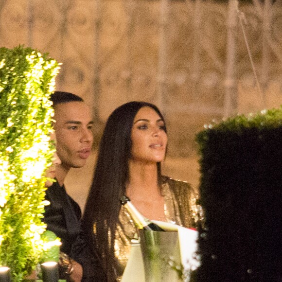 Kim Kardashian et Kanye West à l'after party du show Balmain avec Olivier Rousteing et Kourtney Kardashian au restaurant Loulou à Paris, le 30 septembre 2016