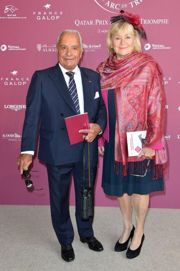 Yves Saint-Martin et sa femme au 95ème Qatar Prix de l'Arc de Triomphe à l'Hippodrome de Chantilly le 2 octobre 2016.