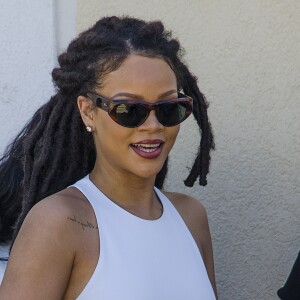 Semi-exclusif - Rihanna et son grand-père Lionel Braithwaite - Rihanna assiste au baptême de son neveu Nicoli Carter dans une église de la Barbade le 9 octobre 2016.