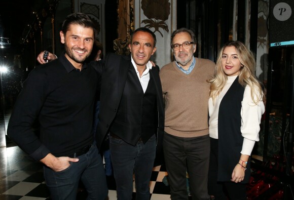 Nikos Aliagas avec Christophe Beaugrand, Nonce Paolini et sa fille Raphaëlle lors de la réception organisée en l'honneur de son entrée au musée Grévin. Paris, le 7 décembre 2016.