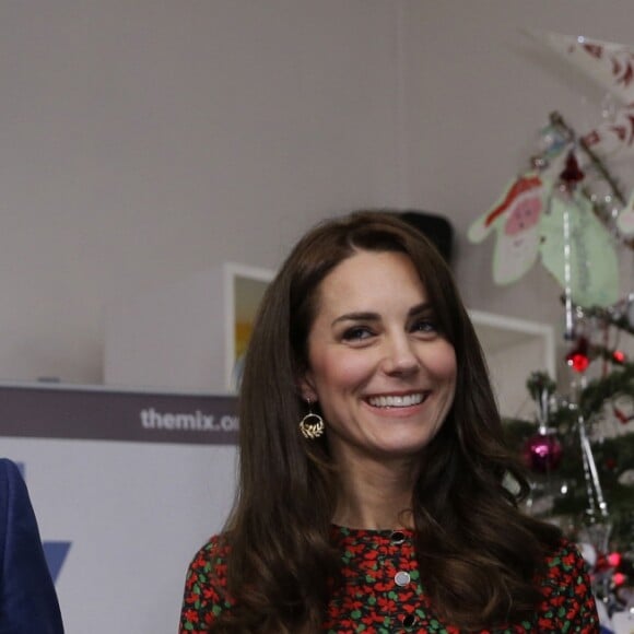 Le prince Harry, Catherine Kate Middleton, duchesse de Cambridge et le prince William, duc de Cambridge, à la réception de Noël de l'établissement "The Mix" à Londres le 19 décembre 2016.