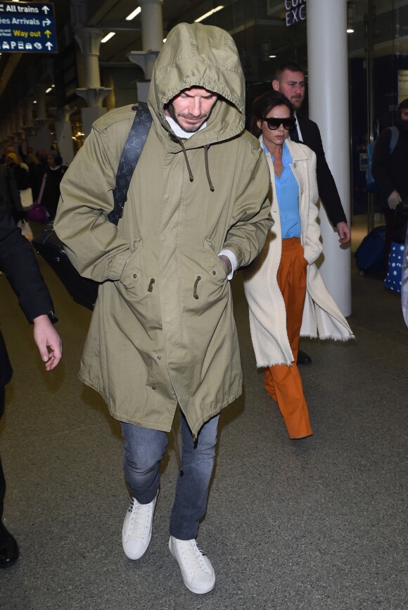 David et Victoria Beckham arrivent à Londres par l'Eurostar en provenance de Paris le 23 janvier 2017.