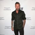 David Beckham pose lors du lancement de la nouvelle collection pour la marque H&amp;M à Los Angeles, le 26 septembre 2016.
