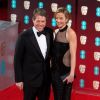 Hugh Grant et sa compagne Anna Elisabet Eberstein - Arrivée des people à la cérémonie des British Academy Film Awards (BAFTA) au Royal Albert Hall à Londres, le 12 février 2017.