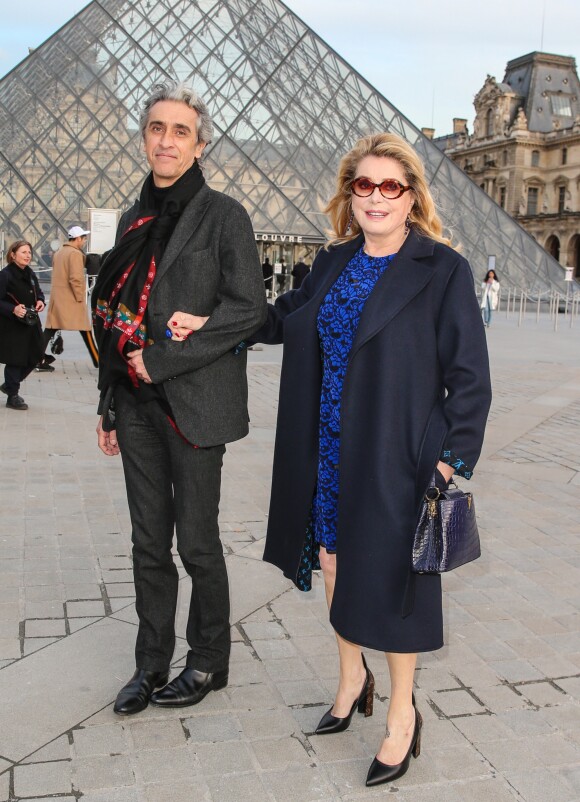 Guest et Catherine Deneuve au défilé de mode "Louis Vuitton", collection prêt-à-porter Automne-Hiver 2017-2018 au Louvres à Paris, le 7 Mars 2017.© Bestimage
