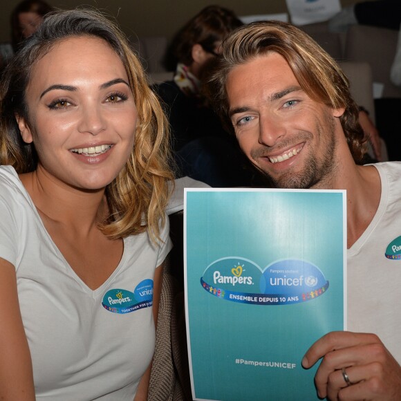 Camille Lacourt et sa femme Valérie Bègue sont les parrain et marraine du 10ème anniversaire du partenariat entre Pampers et l'Unicef pour le vaccin des enfants contre le tétanos. Paris, le 13 novembre 2015 12/11/2015 - 