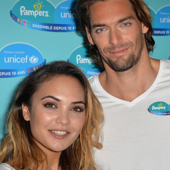 Camille Lacourt et sa femme Valérie Bègue sont les parrain et marraine du 10ème anniversaire du partenariat entre Pampers et l'Unicef pour le vaccin des enfants contre le tétanos. Paris, le 13 novembre 2015 12/11/2015 - 