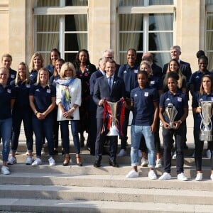 Le président de la République Emmanuel Macron et sa femme Brigitte Macron (Trogneux) reçoivent l'équipe de football féminine de l'Olympique lyonnais (qui a remporté la ligue des Champions) au Palais de l'Elysée à Paris, le 20 juin 2017. © Dominique Jacovides/Bestimage