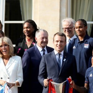 Le président de la République Emmanuel Macron et sa femme Brigitte Macron (Trogneux) reçoivent l'équipe de football féminine de l'Olympique lyonnais (qui a remporté la ligue des Champions) au Palais de l'Elysée à Paris, le 20 juin 2017. © Dominique Jacovides/Bestimage