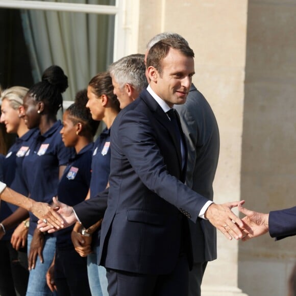 Le président de la République Emmanuel Macron et sa femme Brigitte Macron (Trogneux) reçoivent l'équipe de football féminine de l'Olympique lyonnais (qui a remporté la ligue des Champions) au Palais de l'Elysée à Paris, le 20 juin 2017. © Dominique Jacovides/Bestimage