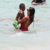 Ludivine Sagna avec son fils sur la plage de Miami, le 12 juillet 2017. © CPA/Bestimage