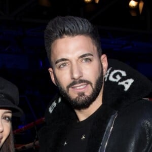 Nabilla Benattia et son compagnon Thomas Vergara, portent le même manteau Balenciaga - Soirée boxe No Limit - Episode II dans l'enceinte du Palais des Sports de Levallois-Perret, France, le 14 décembre 2017. © Cyril Moreau/Bestimage