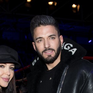 Nabilla Benattia et son compagnon Thomas Vergara, portent le même manteau Balenciaga - Soirée boxe No Limit - Episode II dans l'enceinte du Palais des Sports de Levallois-Perret, France, le 14 décembre 2017. © Cyril Moreau/Bestimage