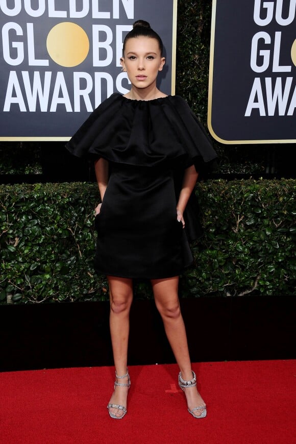 Millie Bobby Brown, habillée d'une robe en satin CALVIN KLEIN BY APPOINTMENT accessoirisée de bijoux Repossi - 75e cérémonie des Golden Globes à l'hôtel Beverly Hilton. Beverly Hills, le 7 janvier 2018.