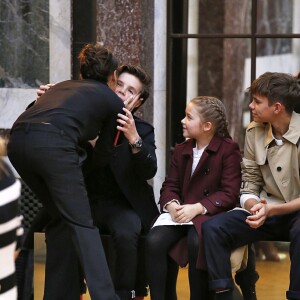 Victoria Beckham embrasse son mari David et leurs enfants à l'ssue du défilé Victoria Beckham, collection prêt-à-porter Automne-Hiver 2018. New York, le 11 février 2018.