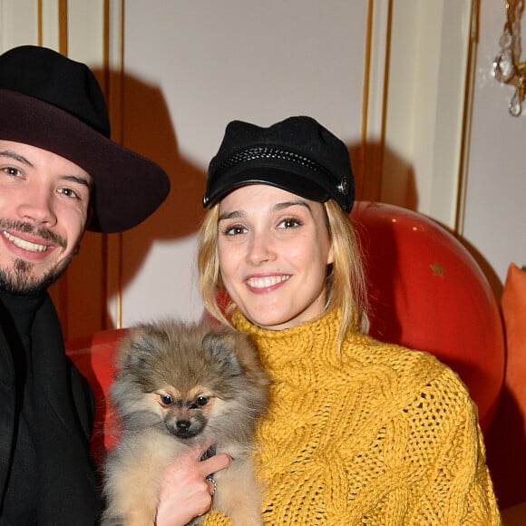 Semi-exclusif - Camille Lou avec son chien Nuts et son cousin Florentin Cabezon (groupe Arcadian) - Goûter du Coeur du prix Clarins pour l'enfance organisé par Clarins, à l'hôtel Plaza Athénée à Paris, France, le 14 février 2018. Clarins poursuit son engagement de solidarité auprès des enfants et lance un nouveau produit "partage" en édition limitée. C'est autour du président du Conseil de Surveillance du Groupe Clarins, que de nombreuses personnalités sont venues découvrir ce nouveau produit "partage" signe de générosité. Tous ont partagé un merveilleux goûter sur le thème du cœur et s’adonner aux joies du patinage sur la splendide patinoire de 100 m2 située dans la cour intérieure du célèbre palace parisien! © Veeren/Bestimage  Semi-Exclusive - Celebs during the "Coeur du prix Clarins pour l'enfance" taste organized by Clarins at the Plaza Athenee Hotel in Paris, France, on February 14, 2018.14/02/2018 - Paris