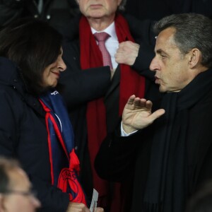 Nicolas Sarkozy et la maire de Paris Anne Hidalgo - People lors du huitième de finale retour de Ligue des Champion, du Paris Saint-Germain contre le Real Madrid au Parc des Princes à Paris le 6 mars 2018. Le Real à remporté le match sur le score de 2 buts à 1. © Cyril Moreau/Bestimage