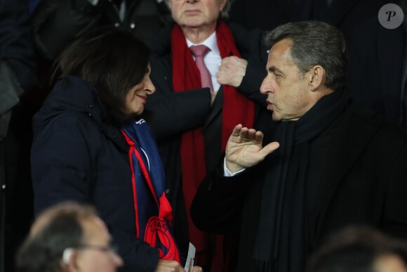Nicolas Sarkozy et la maire de Paris Anne Hidalgo - People lors du huitième de finale retour de Ligue des Champion, du Paris Saint-Germain contre le Real Madrid au Parc des Princes à Paris le 6 mars 2018. Le Real à remporté le match sur le score de 2 buts à 1. © Cyril Moreau/Bestimage