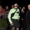 Bella Hadid quitte l'hôtel Royal Monceau à Paris, habillée d'un pull et d'une jupe Off-White™ et chaussée de bottes Mats Rombaut. Le 3 mars 2018.