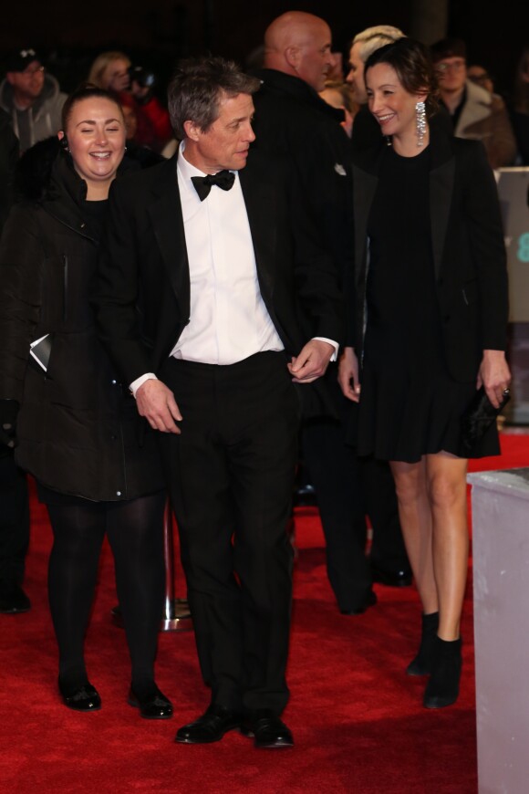 Hugh Grant et sa compagne Anna Eberstein (enceinte) - Arrivée des people à la 71ème cérémonie des British Academy Film Awards (BAFTA) au Royal Abert Hall à Londres, le 18 février 2018