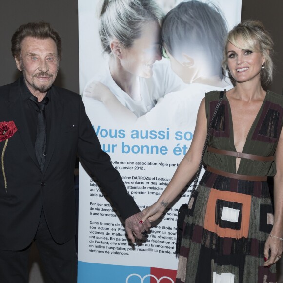 Exclusif - Johnny Hallyday et sa femme Laeticia Hallyday - Soirée au profit de l'Association "La Bonne étoile" de Laeticia Hallyday lors du 3ème Longines Paris Eiffel Jumping à la plaine de Jeux de Bagatelle à Paris le 1er juillet 2016 dans le Pavillon Eiffel du Longines Paris Eiffel Jumping décoré par Luxury Living. © Olivier Borde / Veeren / Bestimage