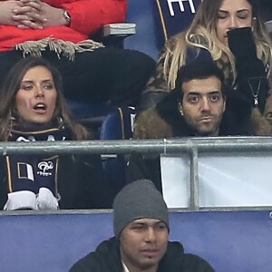 Exclusif - Camille Cerf et Tarek Boudali dans les tribunes du Stade de France lors du match de football amical France - Colombie à Saint-Denis le 23 mars 2018.