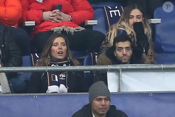 Exclusif - Camille Cerf et Tarek Boudali dans les tribunes du Stade de France lors du match de football amical France - Colombie à Saint-Denis le 23 mars 2018.