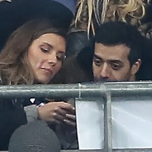 Exclusif - Camille Cerf et Tarek Boudali dans les tribunes du Stade de France lors du match de football amical France - Colombie à Saint-Denis le 23 mars 2018.